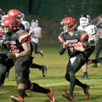Steve Mullensky/for Peninsula Daily News Port Townsend&rsquo;s Berkley Hill picks up a block and rushes for a first down in a against the Klahowya Eagles.