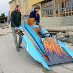 Ben Justice, left, and his friend Donny Regan pull Justice&rsquo;s battered boat up the boat ramp next to the Northwest Maritime Center in Port Townsend. (Cydney McFarland/Peninsula Daily News)
