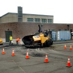 A paving crew from Lakeside Industries installs asphalt Wednesday around a new wastewater pump station along Marine Drive in Port Angeles. (Keith Thorpe/Peninsula Daily News)