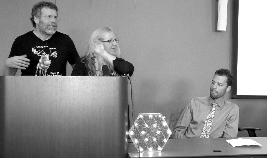 Nicholas K. Geranios (2)/The Associated Press                                Solar Roadways founders Scott Brusaw, left, and Julie Brusaw display a one-third-sized replica of one of their solar pavement panels at a news conference last month in Sandpoint, Idaho, as Sandpoint Mayor Shelby Rognstad looks on at right.