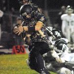 Keith Thorpe/Peninsula Daily News                                Sequim&rsquo;s Tyler Conn tries to elude the Port Angeles defense in the first quarter on Friday night in Sequim.