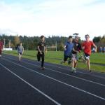 Students from the Port Townsend High School cross-country team play around during practice at the new track at Blue Heron Middle School. The new track, paid for with a capital levy, is used by Port Townsend athletes of all ages. (Cydney McFarland/Peninsula Daily News)