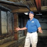 Don Perry, who conducts heritage tours of Port Angeles, describes the experiences of paranormal investigators in a portion of the underground beneath the shops and sidewalks in the downtown area in 2015. (Keith Thorpe/Peninsula Daily News)