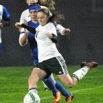 Keith Thorpe/Peninsula Daily News Port Angeles&rsquo; Emily Boyd, front, slips past the defense of North Mason&rsquo;s Abby Leibold as teammate Delany Wenzel, back, looks on at Civic Field in Port Angeles.