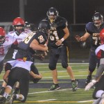 Lonnie Archibald/for Peninsula Daily News                                Forks&rsquo; Jack Dahlgren (99) runs through Neah Bay defenders Curtis LaChester (39) Cole Svec (16) and Logan Halttunen (8) and Josey Tyree (18) on his way to a big gain earlier this season. The Spartans host Hoquiam tonight with a shot at the Evergreen League&rsquo;s second seed to the district playoffs.