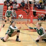 Steve Mullensky/for Peninsula Daily News Port Angeles&rsquo; Kiana Robideau (2) returns a serve and Alyssa Sweet is ready to assist during the Roughriders Olympic League 2A Division tiebreaker against Kingston.