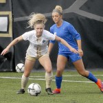 Keith Thorpe/Peninsula Daily News                                Peninsula&rsquo;s Ellie Small, front, fends off the defense of Edmonds&rsquo; Kylie Morse in the first half Saturday in Port Angeles.