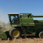 Farmer Sam McCullough uses his combine to harvest quinoa near Sequim. Quinoa, a trendy South American grain, barely has a foothold in American agriculture, but a handful of farmers and university researchers are working toward changing that. (Ted S. Warren/The Associated Press)