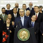 Washington Gov. Jay Inslee speaks Friday at the University of Washington Medical Center in Seattle. Inslee announced an executive order to fight the rising abuse of opioids in Washington state. (Ted S. Warren/The Associated Press)