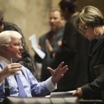 Sam Hunt, D-Olympia, left, talks with with Rep. Sharon Wylie D-Vancouver in Olympia in January 2012. Hunt is a supporter of a measure on the ballot in November that would place an income tax on the highest earners who reside in Olympia to pay for a portion of first-year college or technical school expenses for all Olympia public high school graduates and GED recipients. (Steve Bloom/The Olympian via AP)