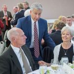 Bill and Esther Littlejohn, seated, talk with Olympic Medical Center CEO Eric Lewis at the Harvest of Hope event last Saturday. The Littlejohns donated $100,000 toward OMC&rsquo;s capital campaign, which includes expansion of the Olympic Medical Center Cancer Center. (Justin Charon)