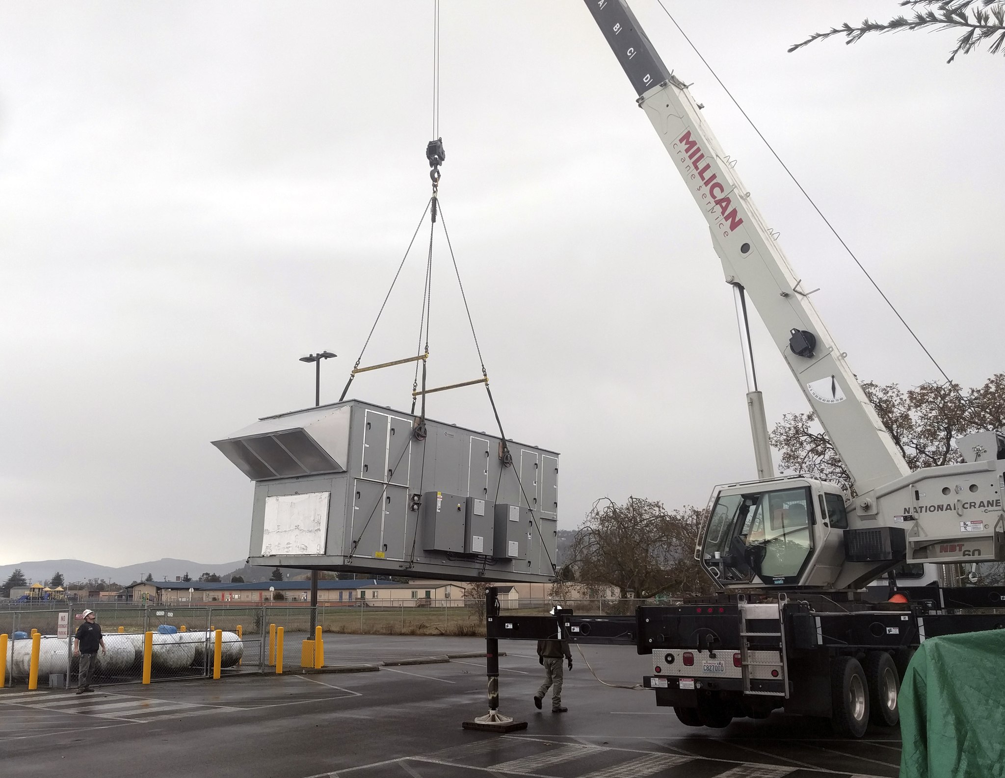 Construction crews unload an air handler at the YMCA of Sequim on Monday. (Frank Pickering)
