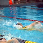 Sydney Swanson swims the 100 backstroke in the YMCA of Sequim. The new facility will host a grand opening Sunday. (Matthew Nash/Olympic Peninsula News Group)