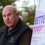 Sequim Mayor Dennis Smith tells people during the grand opening of the YMCA of Sequim on Sunday the YMCA saved a tremendous asset for Sequim by continuing operations at the former Sequim Aquatic Recreation Center. (Jesse Major/Peninsula Daily News)