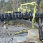 State Department of Transportation Crews worked Tuesday to inspect cracks in the Elwha River bridge on U.S. Highway 101 west of Port Angeles and to install crack monitors. (Jesse Major/Peninsula Daily News)