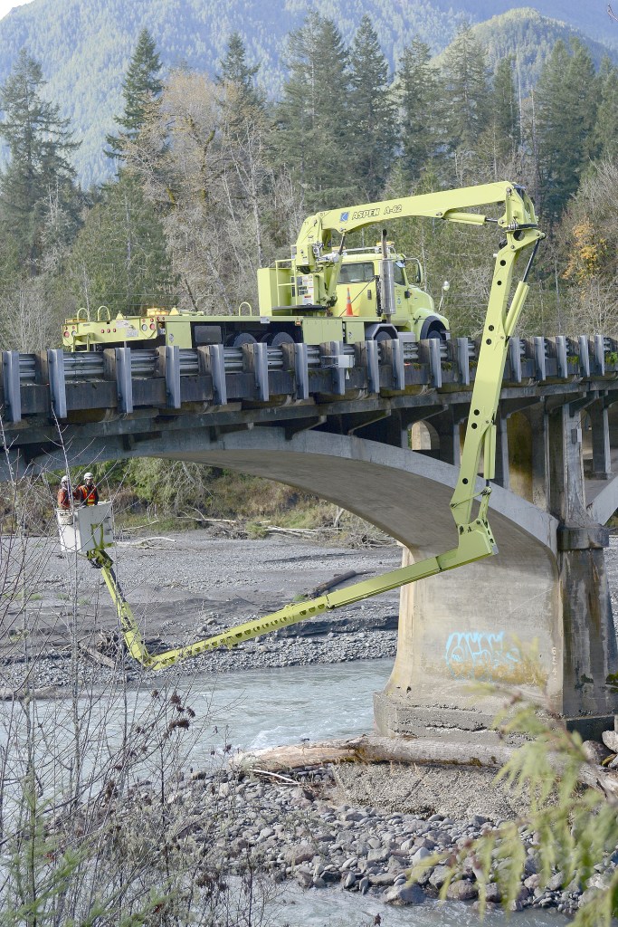 State Department of Transportation Crews worked Tuesday to inspect cracks in the Elwha River bridge on U.S. Highway 101 west of Port Angeles and to install crack monitors. (Jesse Major/Peninsula Daily News)