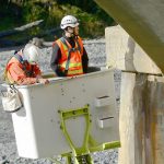 State Department of Transportation crews work Tuesday to inspect cracks in the Elwha River bridge on U.S. Highway 101 west of Port Angeles and to install crack monitors. (Jesse Major/Peninsula Daily News)