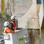 State Department of Transportation crews work Tuesday to inspect cracks in the Elwha River bridge on U.S. Highway 101 west of Port Angeles and to install crack monitors. (Jesse Major/Peninsula Daily News)