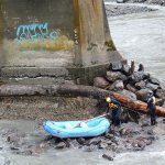 Crews continue to monitor the Elwha River bridge on U.S. Highway 101 west of Port Angeles on Wednesday. (Jesse Major/Peninsula Daily News)