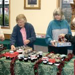 &ldquo;Jammers&rdquo; Sandra Crook, Sudie Mason, Katt Osborne and Betty Nicholson, from left, start to set out the more than 400 handmade half-pint jars of jams and jellies women of First United Methodist Church in Port Angeles have made this year. One of their specialties will be a preserve called &ldquo;gourmet mustard.&rdquo;