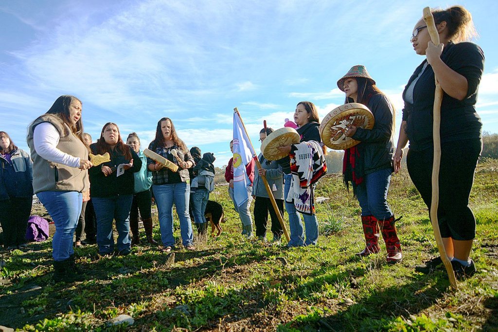 Members of the Lower Elwha Klallam Tribe sing the Help Song on Thursday to show support for the Standing Rock Sioux Tribe in its efforts to prevent the Dakota Access Pipeline from crossing the Missouri River. (Jesse Major/Peninsula Daily News) ​