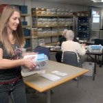 Clallam County Auditor Shoona Riggs carries a mailing tray of ballots at the county&rsquo;s elections center Saturday at the county courthouse in Port Angeles. (Keith Thorpe/Peninsula Daily News)