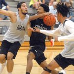 Keith Thorpe/Peninsula Daily News Peninsula College mens team players, from left, Jarod Felix, Elijah Williams and Zach Day, take part in an intrasquad scrimmage on Friday night on their home court in Port Angeles.