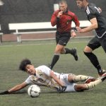 Keith Thorpe/Peninsula Daily News                                Peninsula&rsquo;s Joey Hollimon hits the turf after getting tangled up with Tacoma&rsquo;s Tanner Allison in the first half of their NWAC playoffmatch on Saturday at Wally Sigmar Field in Port Angeles.