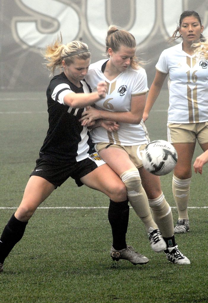 Keith Thorpe/Peninsula Daily News                                Walla Walla&rsquo;s Haley Berryman, left, and Peninsula&rsquo;s Audrey Barham, center, fight for the ball as Barnham&rsquo;s teammate Isabel Vega, right, looks on during Saturday&rsquo;s NWAC playoff game in Port Angeles.