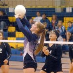 Keith Thorpe/Peninsula Daily News Quilcene&rsquo;s Allison Jones, front, sets the ball as Neah Bay players, from left, Starlena Haltunnen, Alicia Loomis and Elizabeth Jimmicum prepare to defend during the first game of Saturday&rsquo;s tri-district match at Crescent High School in Joyce.