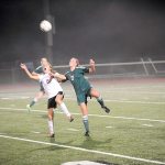 Matthew Nash/Olympic Peninsula News Group                                Sequim&rsquo;s Jessica Dietzman and Port Angeles&rsquo; Kyrsten McGuffey jump for a loose ball during a West Central District tournament soccer match. The Roughriders won in penalty kicks to clinch their first state appearance in 30 years.