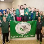 The Port Angeles girls&rsquo; swim team celebrates after winning the West Central District 3 championship Saturday.