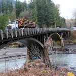 State Department of Transportation officials told some 60 government officials and local leaders Tuesday that WSDOT is still exploring options for the Elwha River bridge on U.S. Highway 101 after discovering it was built on gravel and not bedrock. (Jesse Major/Peninsula Daily News)