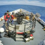 A crew member aboard the Coast Guard cutter Active, a 210-foot medium-endurance cutter homeported in Port Angeles, fires a 25mm gun during underway training Sept. 10. (U.S. Coast Guard)
