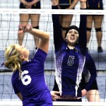 Roger Harnack/Daily Sun News Quilcene&rsquo;s McKenzie Kieffer (5) prepares to block a return by Odessa-Harrington&rsquo;s Maddy Wagner during the Class 1B State Volleyball Tournament at the Yakima Valley SunDome.