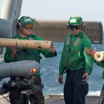 Sailors unload sonobuoys from an MH-60R Sea Hawk helicopter aboard the guided-missile cruiser USS Mobile Bay in the Arabian Sea in 2012. (U.S. Navy)