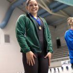 Port Angeles High School photo                                Port Angeles&rsquo; Jaine Macias receives her medal for winning the 100-yard breaststroke at the State 2A Swim and Dive Championships Saturday at the King County Aquatic Center.