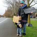 Sabrina Hill and 3-year-old Mary Hill participated in a protest against the Dakota Access Pipeline on Tuesday in Port Townsend. The protest was one of many happening across the United States for the National Day of Action in Support of Standing Rock. (Cydney McFarland/Peninsula Daily News)