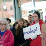 Supporters of the Standing Rock Sioux Tribe&rsquo;s opposition to the Dakota Access Pipeline listen as members of the Lower Elwha Klallam Tribe sing during a protest of the pipeline in downtown Port Angeles on Tuesday. (Jesse Major/Peninsula Daily News)