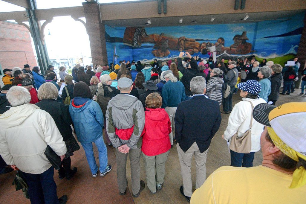 A crowd listens as members of the Lower Elwha Klallam Tribe sing during a protest of the Dakota Access Pipeline in downtown Port Angeles on Tuesday. (Jesse Major/Peninsula Daily News)