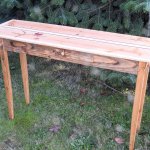 Using boards salvaged from the old Railroad Bridge decking, craftsman Tom Butler created a one-of-a kind, 45-inch-long table.