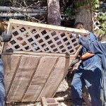 Three members of the U.S. Coast Guard help the Clallam County Hoarding Task Force clean up the home of an elderly person suffering from hoarding disorder earlier this year. (Clallam County Hoarding Task Force)