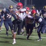 McClatchy News Service Neah Bay quarterback Rwehabura Munyagi Jr. scores a touchdown late in the Red Devils&rsquo; 66-26 win over Tacoma Baptist.
