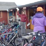 Nhatt Nichols of The ReCyclery in Port Townsend explains the rules of Cranksgiving to participants Saturday afternoon. (Cydney McFarland/Peninsula Daily News)