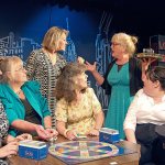 Florence Ungar, portrayed by Janet Lucas, standing at right, and Olive Madison, portrayed by Lynne Murphy, standing at left, squabble during a rehearsal of &ldquo;The Odd Couple.&rdquo; (Robert Bronsink)