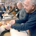 Volunteer Jim Simcoe of Port Townsend ladles gravy at the Thanksgiving meal at the Tri-Area Community Center in Chimacum. (Cydney McFarland/Peninsula Daily News)