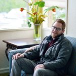 Chris Townsend tells of the help he received as he sits in his room at the Bayside Hotel in Port Hadlock. (Diane Urbani de la Paz/for Peninsula Daily News)
