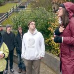 Zhaleh Almaee Weinblatt of the Mandala Center for Change in Port Townsend leads roughly two dozen community members in a song during the Rally Against Hate on Saturday morning. (Cydney McFarland/Peninsula Daily News)