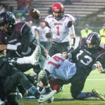 Photo by Evan Abell/Bellingham Herald                                Lummi&rsquo;s Free Borsey fumbles at the goal line while being tackled by Neah Bay&rsquo;s Tommy Tyler and Cameron Buzzell on Saturday, Nov. 26, at Everett Memorial Stadium in Everett. Neah Bay recovered the ball.
