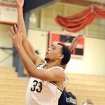 Peninsula College photo Kevin Baker layup over Portland&rsquo;s Darrell Henry during a Saturday game in Mount Vernon at the Skagit Valley Turkey Tournament.